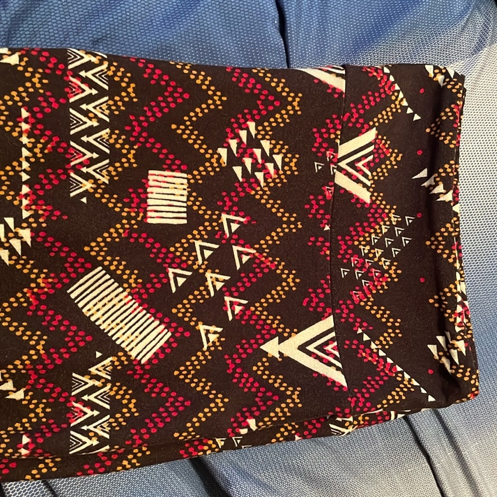 LuLaRoe Tall and Curvy leggings black w/red, light green and brown pattern